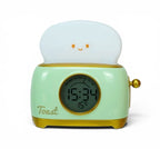 Réveil veilleuse toaster vert présenté de face sur fond clair
