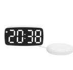 Réveil vibrant blanc présenté sur fond blanc avec affichage LED blanc et coussin vibrant